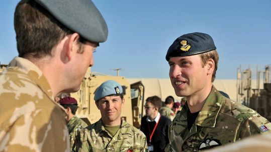Prince William speaks with member of Commando Helicopter Force during a visit to Afghanistan in 2010