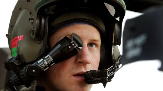 Image ID: DY775H: Prince Harry wears a  monocle gun sight as he sits in the front seat of his cockpit while serving as an Apache Helicopter Pilot/Gunner in 2021 (Picture: WENN Rights Ltd / Alamy).