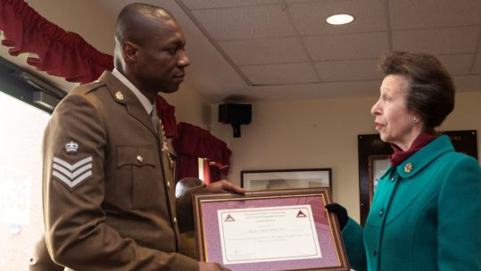 Princess Anne presents an award to a soldier at Merville Barracks (Picture: British Army).