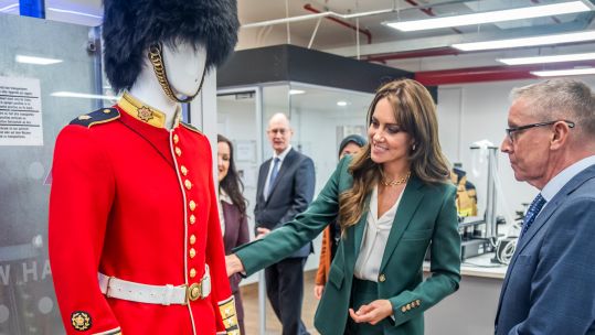 Princess of Wales looks at a Guardsmans scarlet tunic during a visit to AW Hainsworth in Leeds 26092023 NO REUSE CREDIT PA WIRE, PA IMAGES