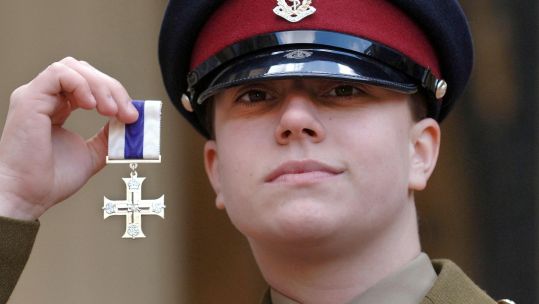 Private Michelle Norris and her Military Cross. Credit PA 