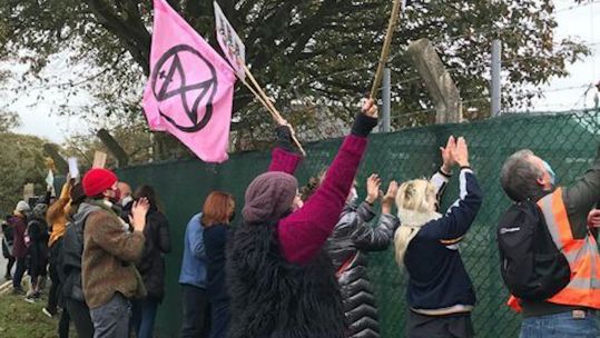 Pro-migrant demonstrators outside Napier Barracks in Folkestone Kent gathered in a show of support welcoming migrants to the area (Picture: PA).