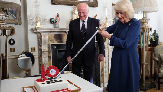 Queen Camilla hosts celebration for Poppy Factory alongside President Surgeon Rear Admiral Lionel Jarvis 15022024 NO REUSE CREDIT PA WIRE, PA IMAGES