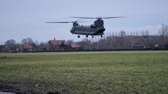 RAF Chinook flies from a field near Wantage in Oxfordshire after getting stuck