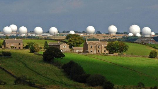 RAF Menwith Hill randomes with buildings in foreground