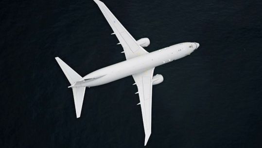 RAF Poseidon maritime patrol aircraft, flying over coast of Scotland, it has dropped a recoverable torpedo in an exercise 22072021 CREDIT MOD