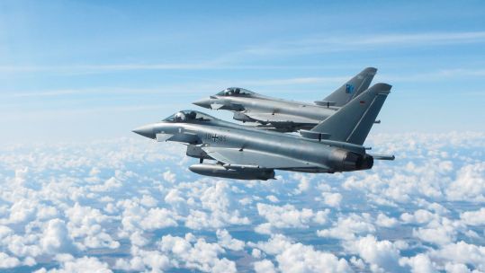Cover image: An RAF Typhoon and German Air Force Eurofighter flying in formation during a practice interception mission over Lithuania (Picture: MOD).