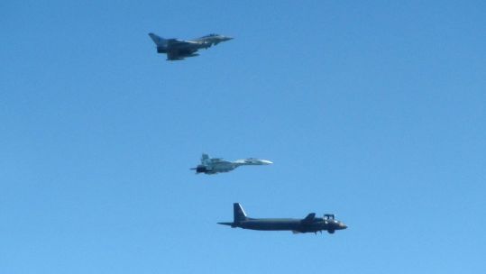 Cover image: RAF Typhoon pictured flying alongside two of the Russian jets (Picture: RAF).