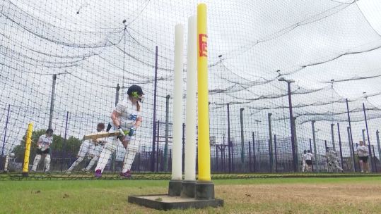 The RAF women's cricket squad trains in the nets.
