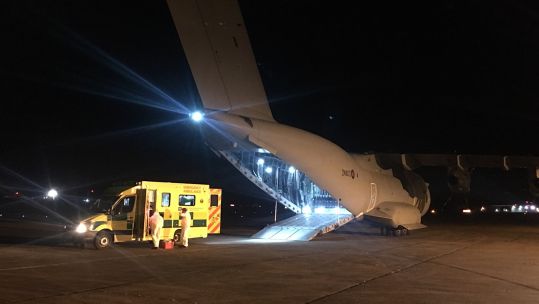RAF working with health workers to transport the patient (Picture: ArmedForcesNI/ Twitter).