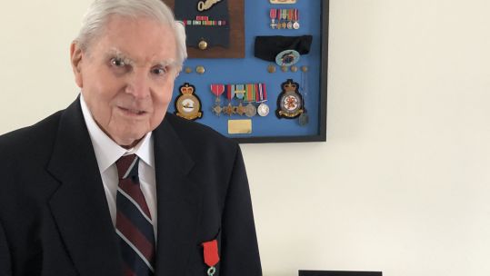 Cover image: Mr Booker with the Legion D'Honneur (Picture: SSAFA).