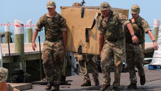 RFA Mounts Bay crew delivering aid to Fox Town on Little Abaco