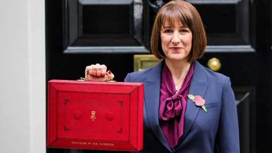 Rachel Reeves, Chancellor of the Exchequer of the United Kingdom, is seen with the red dispatch box (budget box) outside 11 Downing Street in Westminster