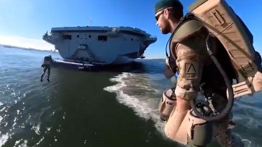 Real-life 'Iron Men' made quite the entrance onto HMS Queen Elizabeth 28092022 CREDIT Royal Navy Twitter