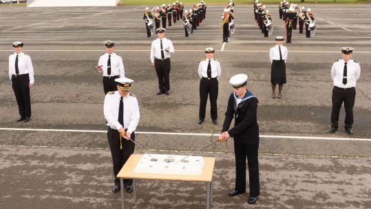 Cover image: Rear Admiral Phil Hally and Engineering Technician, Brendan Overal cutting the birthday cake at HMS Collingwood Picture: Crown Copyright). 