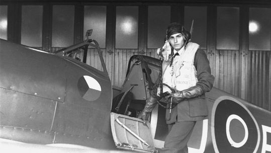 This image recreates a pilot preparing to climb into the cockpit of his Supermarine Spitfire, ready to take on the Luftwaffe
