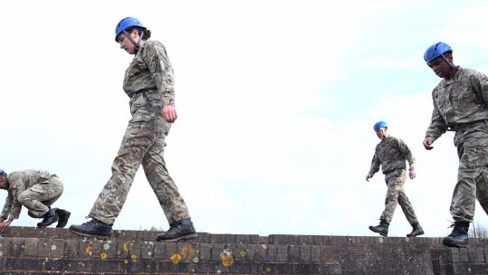Recruits of Gould 2119 class on an obstacle course at HMS Raleigh, Cornwall