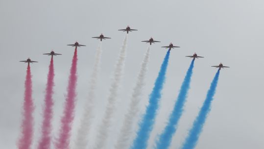 Red Arrows during military flypast over Buckingham Palace for King's coronation 060523 CREDIT MOD.jpg