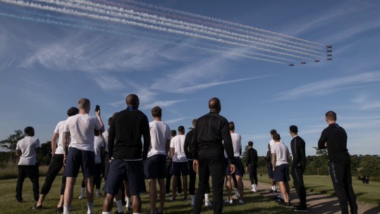 Red Arrows fly over the England squad