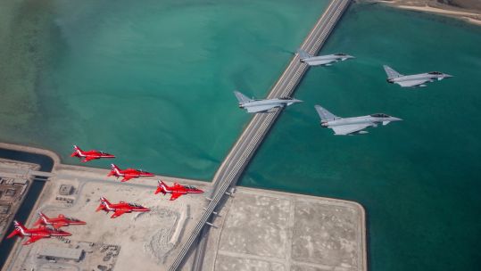 Red Arrows joined QEAF and RAF Typhoon jets for a fly-past in Qatar