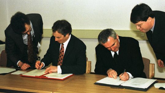 Reuters – Ahern and Blair sign the peace agreement 100498