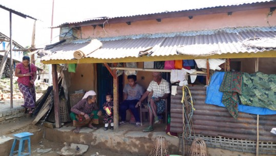 Rifleman Kul Bahadur Gurung with his family outside their temporary accommodation