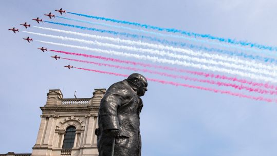 Royal Air Force Red Arrows flying over the statue of Sir Winston Churchill on the 75th anniversary of VE Day. 080520 CREDIT MOD