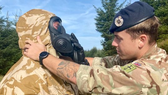 Royal Engineer soldier assists with CBRN equipment Exercise Cambrian Patrol 221023 CREDIT BRITISH ARMY