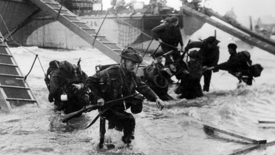 Royal Marine Commandos going ashore during D-Day (Picture: PA).