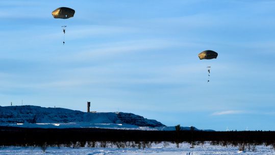 Cover Image: Royal Marines parachute on Exercise Cold Response (Picture: MOD).