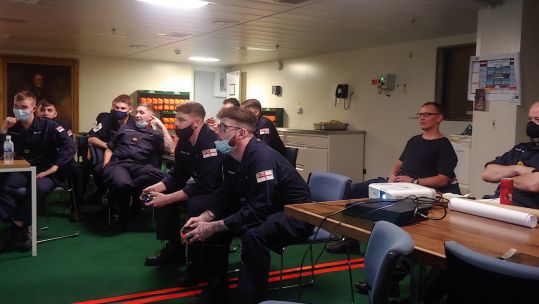 Royal Navy personnel on board HMS Queen Elizabeth take part in FIFA tournament at sea