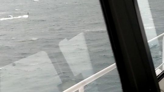 Royal Navy submarine periscope seen from Stena Superfast VII ferry