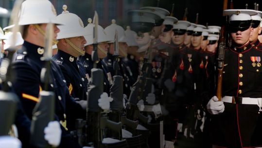 Merged image of British Royal Marines on parade on the left and American marines on parade on the right
