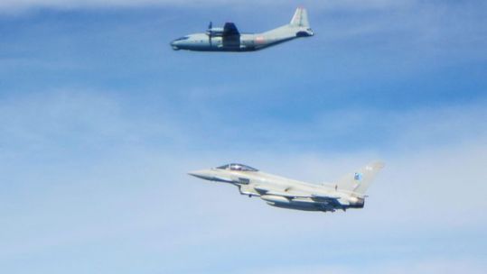 Russian Antonov AN-12 aircraft (top) with an RAF Typhoon