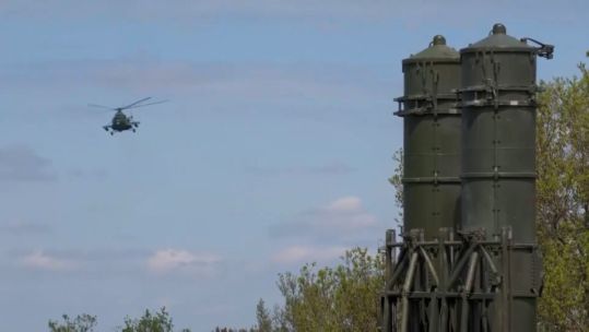 Russian S-300V missile seen with a helicopter in the background (Picture: Russian MOD).