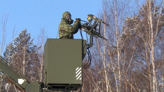 Russian personnel testing a sprayed substance (Picture: Russian MOD).