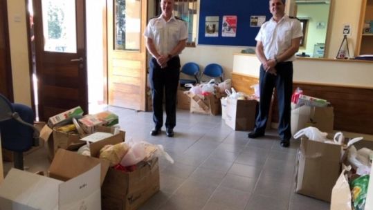 Cover image: Officers stand with the boxes of food (Picture: British Forces Cyprus).