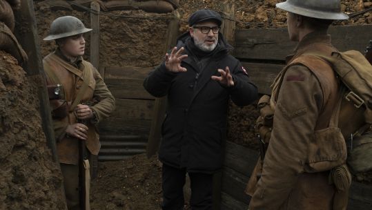Sam Mendes on set with lead actors, George McKay and Dean-Charles Chapman