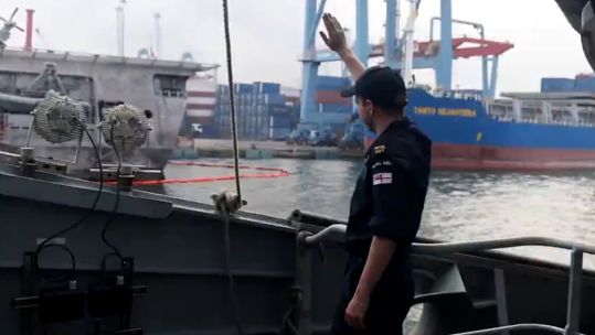 Sailor on deck of HMS Spey in Indonesia