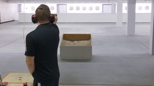 Sergeant Sam Gowin taking aim.