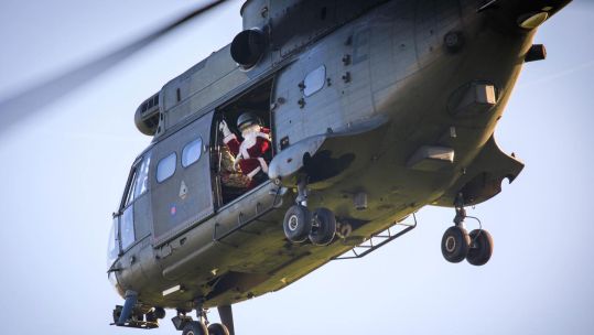 Santa Claus Father Christmas RAF Benson Puma helicopter CREDIT RAF Benson Crown Copyright