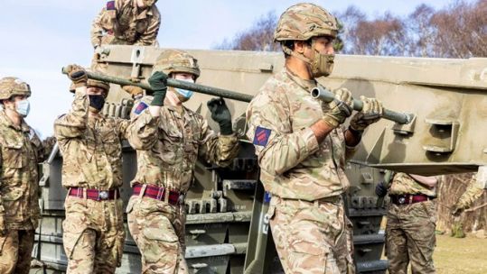 Cover image: The newly-posted soldiers practise assembling a medium girder bridge (Picture: MOD).