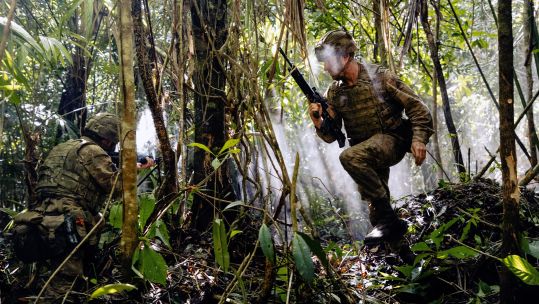 Scots Guards soldier fires from kneeling position as another sprints left during live firing range on Exercise Mayan Storm 19112021 CREDIT MOD Crown.jpg