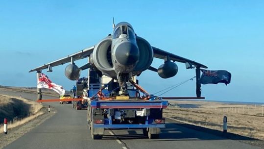 Sea Harrier ZH801 is taken by road on the last leg of her long journey to the Falkland Islands museum (Picture: Royal Navy)