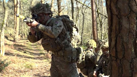 REME soldiers take part in a fieldcraft exercise at Bordon