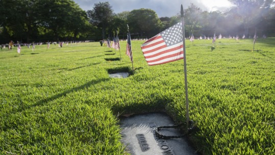 US flags over un known soldier's tomb from the Korean War at the National Memorial Cemetery of the Pacific in Honolulu, Hawaii. (Pictures: PA Images)