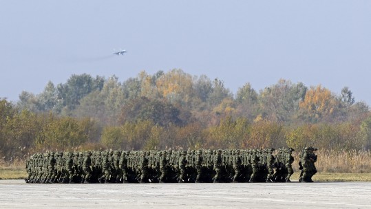 Serbian infantry force members march during a military parade