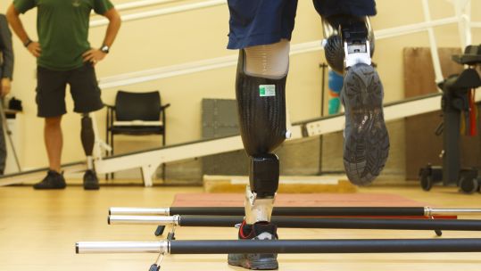 Serving military personnel in the gym using their prosthetic legs at the Defence Medical Rehabilitation Centre, Headley Court near Leatherhead in Surrey