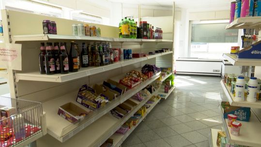 Shelves inside Little England convenience store in Sennelager, Germany 