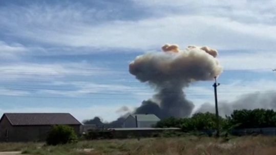 Smoke billowing from Crimea where authorities say a Russian air base was hit with explosions.